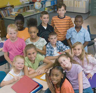 Students gathered together in a group in the classroom